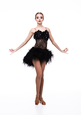 Beautiful ballroom dancer girl in elegant pose black dress on white backgroundの写真素材