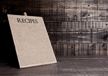 Recipes linen kitchen wooden board for kitchen on wooden table backgroundの写真素材