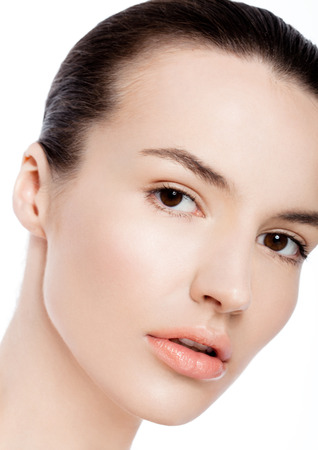Beautiful woman girl natural makeup spa skin care portrait on white backgroundの写真素材
