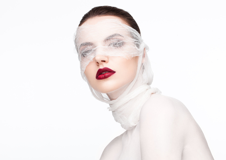 Beauty makeup plastic surgery white bandage model contept on white backgroundの写真素材
