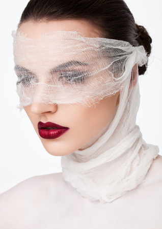 Beauty makeup plastic surgery white bandage model contept on white backgroundの写真素材
