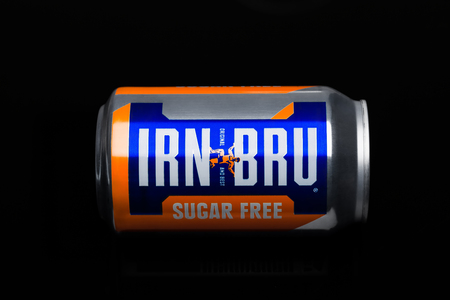 LONDON, UK - MARCH 15, 2017: Can of Irn-Bru lemonade soda drink on black background. Produced by Barr in Scotland, UKのeditorial素材
