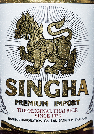 LONDON, UK - MARCH 15, 2017: Bottle close up logo of Singha beer on white background , Singha beer is most popular in thailand , Rayong , Thailandのeditorial素材
