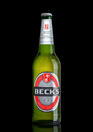 LONDON, UK - MARCH 15, 2017: Bottle of Becks beer on black background with reflection. Becks brewery was founded in 1873 in Bremen, Germany.のeditorial素材