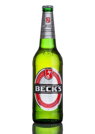 LONDON, UK - MARCH 15, 2017: Bottle of Becks beer on white background with reflection. Becks brewery was founded in 1873 in Bremen, Germany.のeditorial素材