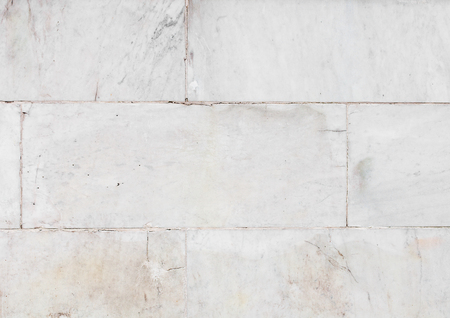 Ivory white marble tile texture background with cracksの写真素材