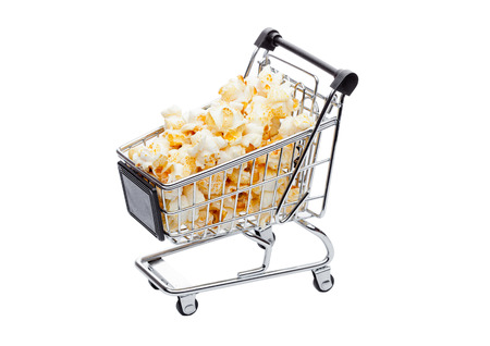 Popcorn salty sweet snack in shopping carton white backgroundの写真素材
