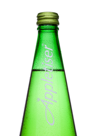 LONDON, UK -DECEMBER 07, 2017:  Bottle of Appletiser apple juice gently sparkling drink on white Background.のeditorial素材