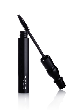 LONDON, UK - JANUARY 02, 2018: MAC False Lashes mascara container with brush on white background. MAC Cosmetics was founded in Toronto, Ontario, Canada in 1984.のeditorial素材