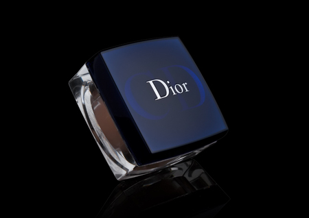 LONDON, UK - FEBRUARY 02, 2018: Glass container of Dior dry face cosmetics powder on black background.のeditorial素材