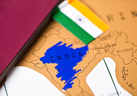Travel holiday to India concept with passport and flag 