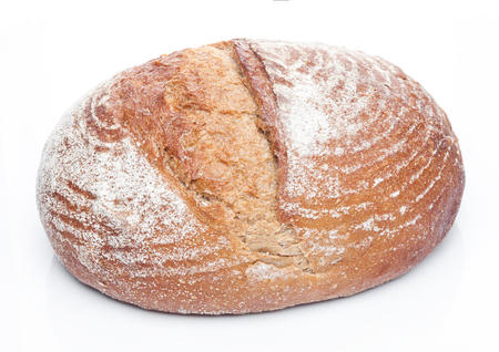 Freshly baked  loaf of bread with flour on white background