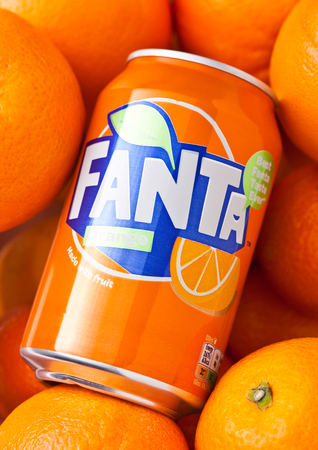 LONDON, UK - MARCH 31, 2018: Aluminium tin of Fanta orange soft drink on oranges backgroundのeditorial素材