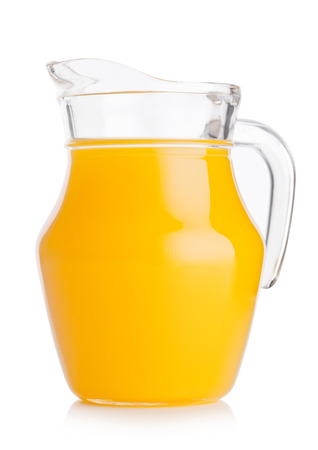 Glass jar of organic fresh orange smoothie juice with reflection on white backgroundの写真素材