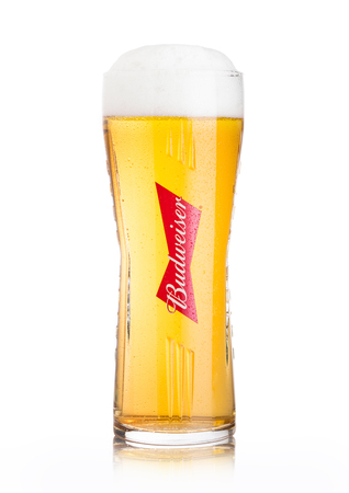 LONDON, UK - JUNE 02, 2018: Cold original glass of Budweiser Beer on white background, an American lager first introduced in 1876.のeditorial素材