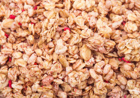Organic fresh cereal granola flakes with fruits macro textureの写真素材