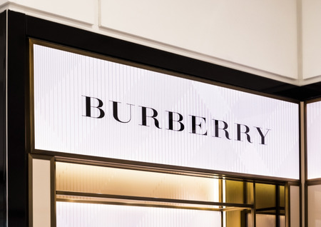 AMSTERDAM, NETHERLANDS - JULY 18, 2018: Burberry light billboard in shopping centre. in duty free shop.のeditorial素材