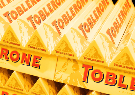 LONDON, UK - AUGUST 31, 2018: Tubes of Toblerone chocolate in grocery store with logo. Close upのeditorial素材