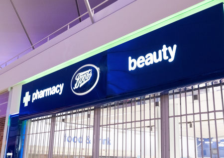 LONDON, UK - AUGUST 31, 2018: Boots and Pharmacy display in shopping centre store.のeditorial素材