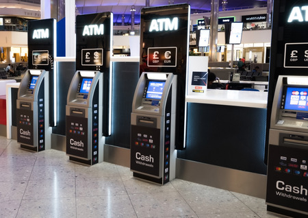 LONDON, UK - AUGUST 31, 2018: ATM cash machines in international airport.のeditorial素材