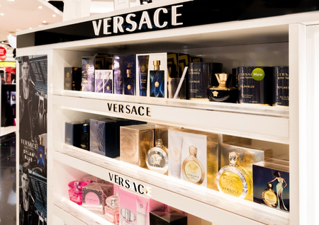 LONDON, UK - AUGUST 31, 2018: Versace perfume and cosmetic luxury collection in boutique store. Elegant shop.のeditorial素材
