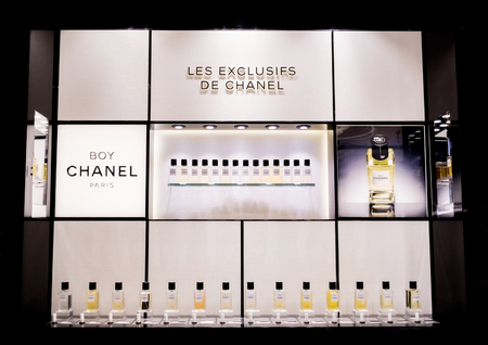 LONDON, UK - AUGUST 31, 2018: Chanel perfume and cosmetic makeup luxury collection in boutique store. Elegant shop.のeditorial素材