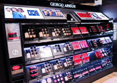 LONDON, UK - AUGUST 31, 2018: Giorgio Armani Lipstick and cosmetic perfume collection in the Duty Free Store Airport.のeditorial素材