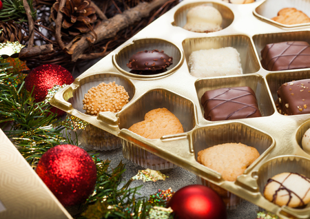 Luxury belgian christmas chocolate and biscuit cookies selection in box with christmas and new year holidays decoration .の写真素材
