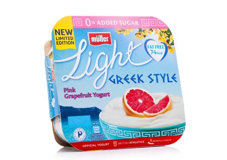 LONDON, UK - NOVEMBER 08, 2019: Pack of Muller Light Greek Style Yogurt with grapefruit on white.のeditorial素材