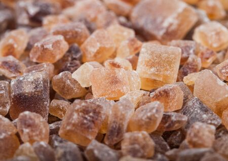 Close-Up shot of natural caramelized sugar cubes on white.の写真素材