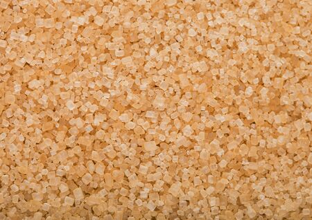 Close-Up shot of natural brown refined sugar cubes on white. Top viewの写真素材