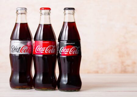 LONDON, UK - AUGUST 03, 2018: Glass bottles of Original Diet and Zero Coca Cola soft drink on wood. Most popular drink in the world.のeditorial素材
