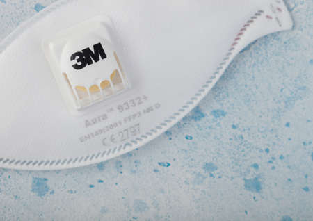 LONDON, UK - MAY 11, 2020: Face mask, level FFP3  by 3M 9332+ on blue. Best protection from coronavirus, germs,bacteria and virusesのeditorial素材