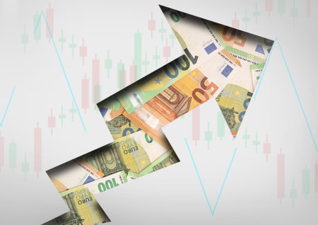 Concept arrow going up for stock trading with euro banknotes and stick candles chart.Top view.の写真素材
