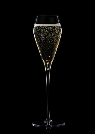 Glass of prosecco champagne wine on black with bubbles.の写真素材