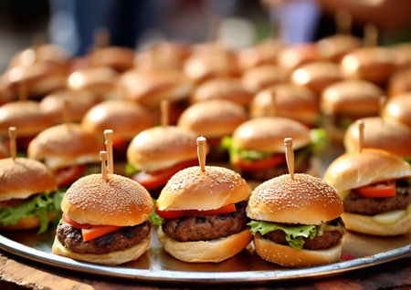 Mini beef burgers with cheese,lettuce and tomato with sauce on steel plate.AI Generativeの素材
