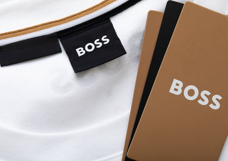 LONDON, UK - FEBRUARY 12, 2024: Boss black label on premium white fabric t-shirt.Macro.のeditorial素材