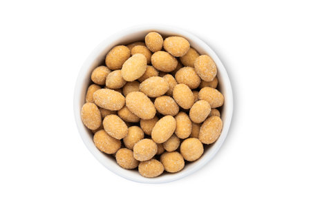 Bowl with salted peanut nuts with sour cream taste isolated on white background.の写真素材