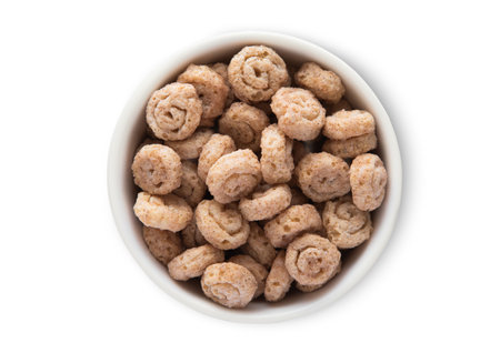 Top view bowl with crunchy cinnamon buns breakfast cereal on white.の写真素材