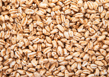 Macro shot of honey rice crispies morning cereal breakfast textured background.の写真素材