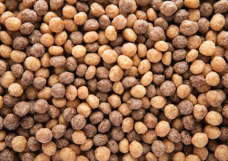 Crunchy peanut butter and chocolate puffs breakfast cereal textured macro shot.の写真素材