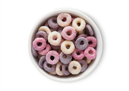 Top view bowl with various fruits circles and vitamins breakfast cereal on white.の写真素材