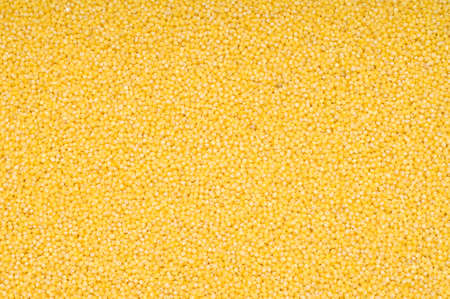 Millet background, yellow small groats, close-up, cooking ingredientsの写真素材