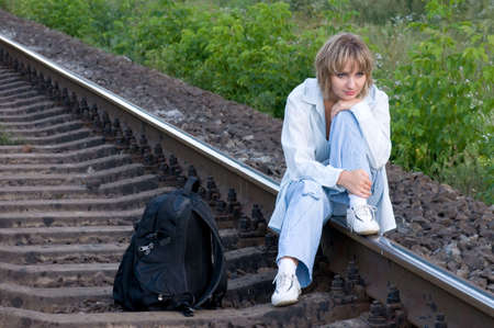 Beautiful young woman waiting for the trainの写真素材