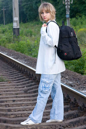 Beautiful young woman waiting for the trainの写真素材