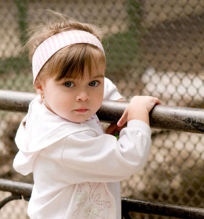 Portrait of little beautiful girl wearing headbandの写真素材