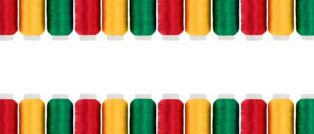 Hanks of multi-coloured threads for embroidery on a white backgroundの写真素材