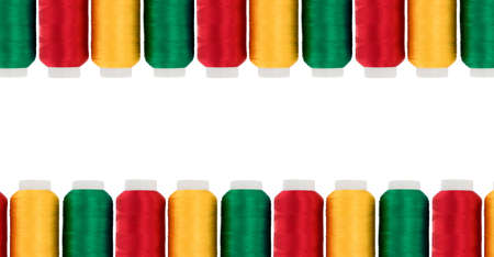 Hanks of multi-coloured threads for embroidery on a white backgroundの写真素材