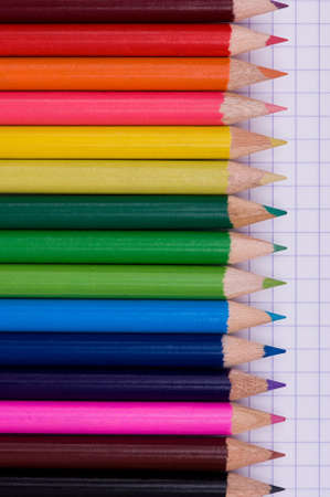 Close-up image of multicolor pencils on paper backgroundの写真素材