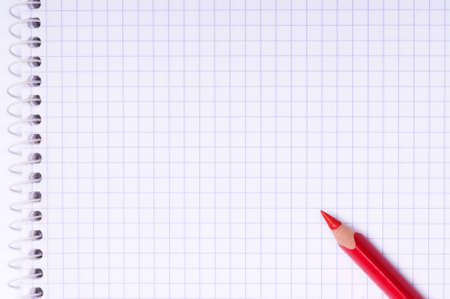 Close-up image of red pencil on paper backgroundの写真素材